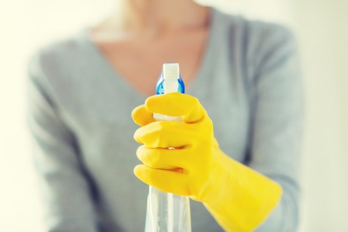 Cleaner disinfecting high-touch surfaces in a business environment
