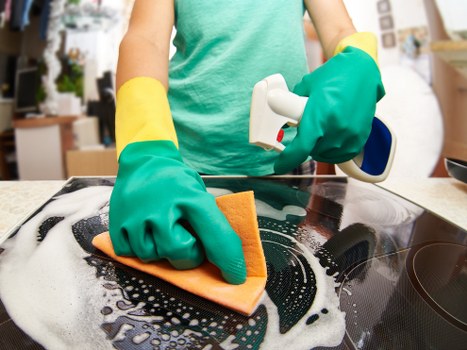 Vacuuming a mattress to remove dust and allergens